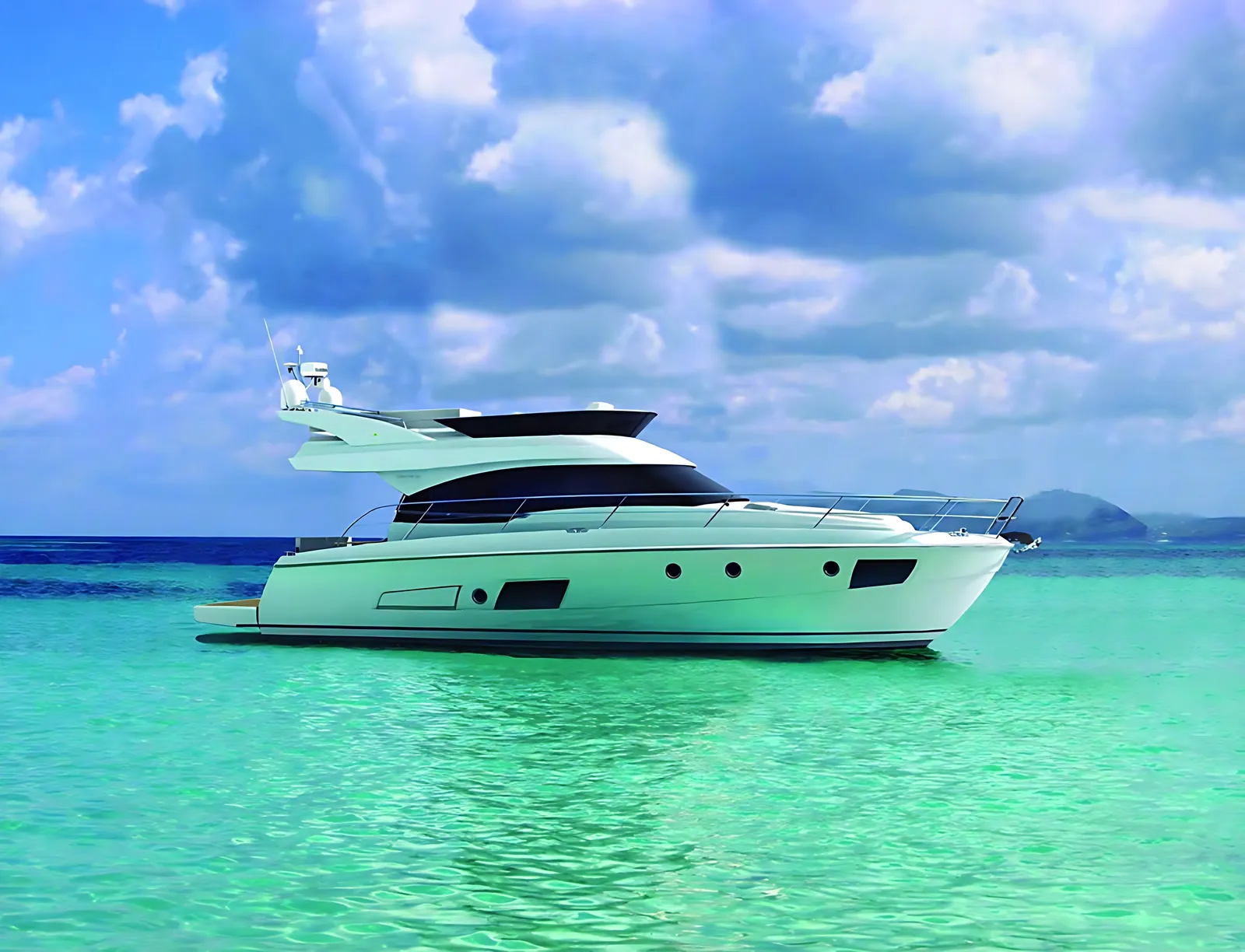Bavaria 42 Fly flybridge cruiser on turquoise water under a cloud-filled sky