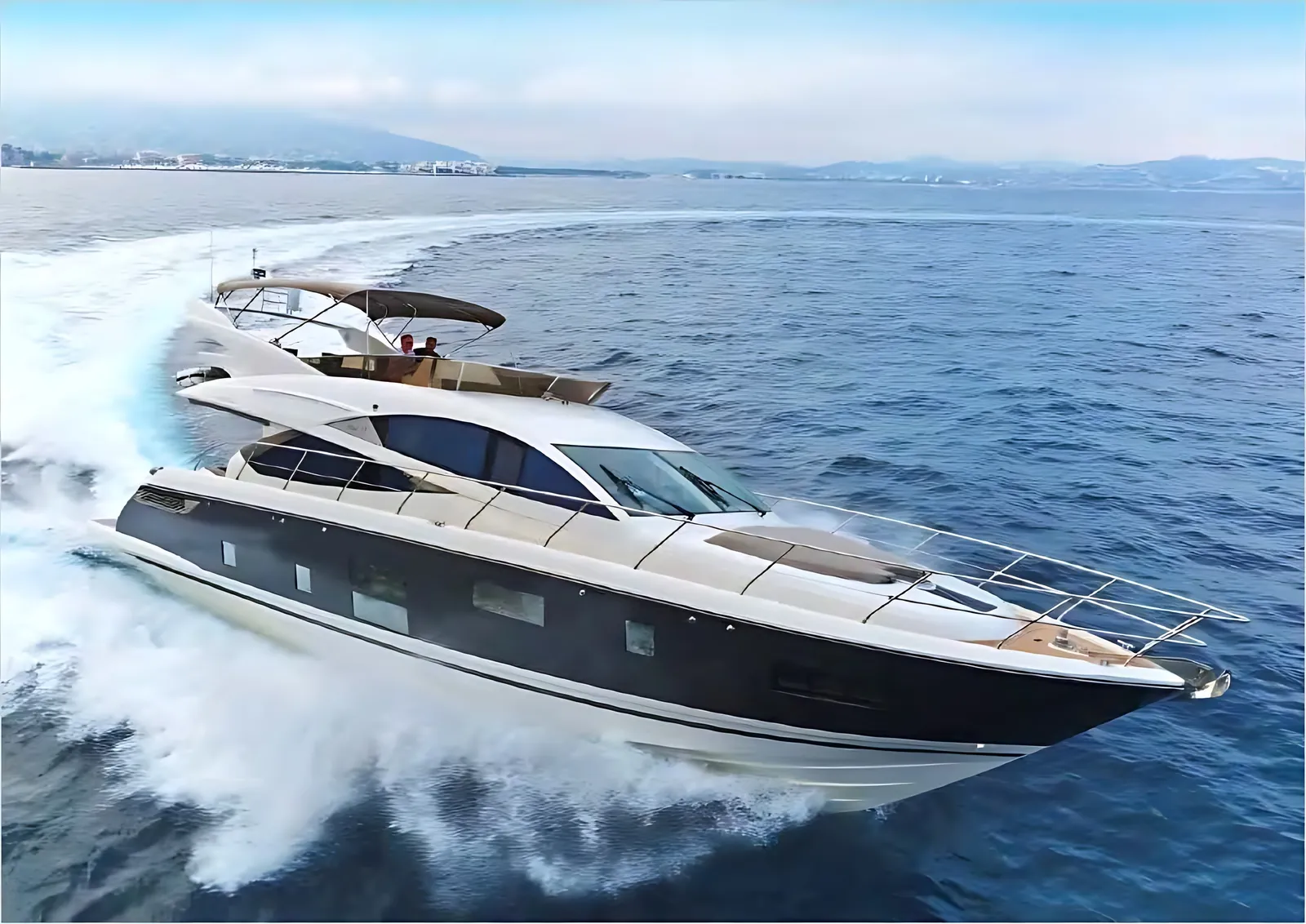 Pearl 65 flybridge motor yacht running at speed with a white wake and a coastline behind