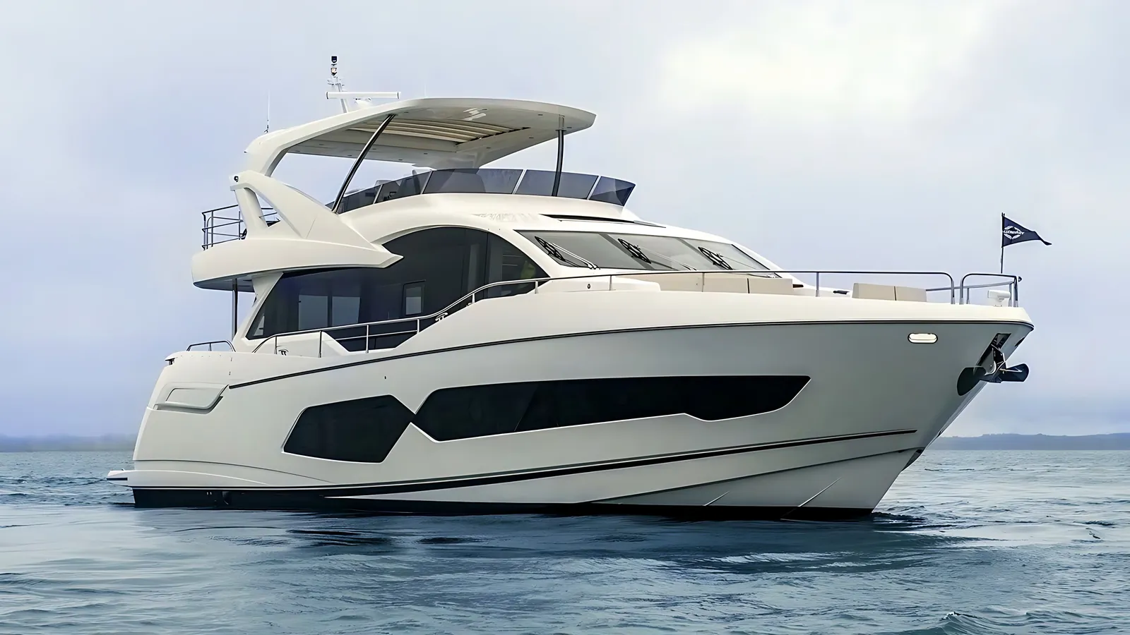 Sunseeker 76 flybridge yacht at rest on open water under a soft grey sky, seen from the bow quarter
